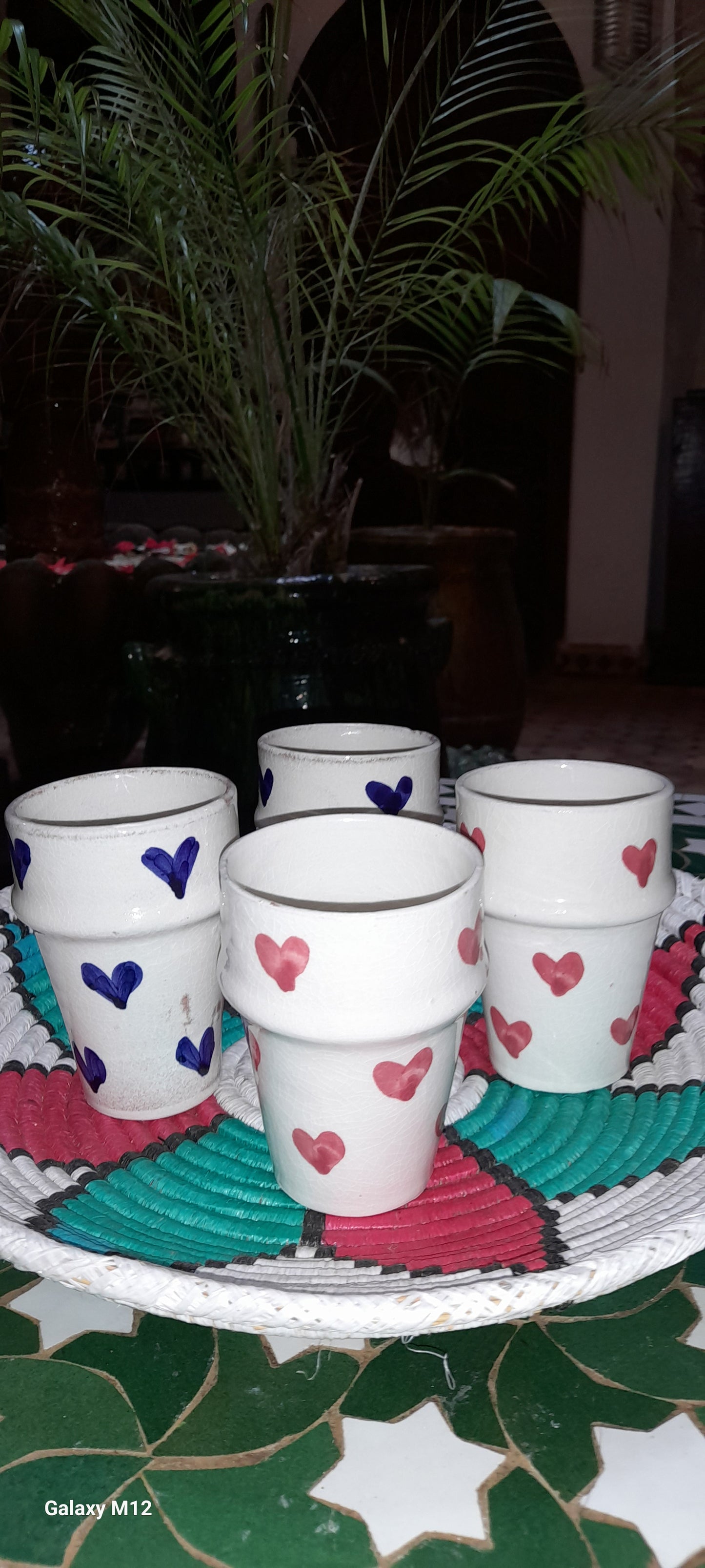 Handmade coffee cups with red and blue hearts