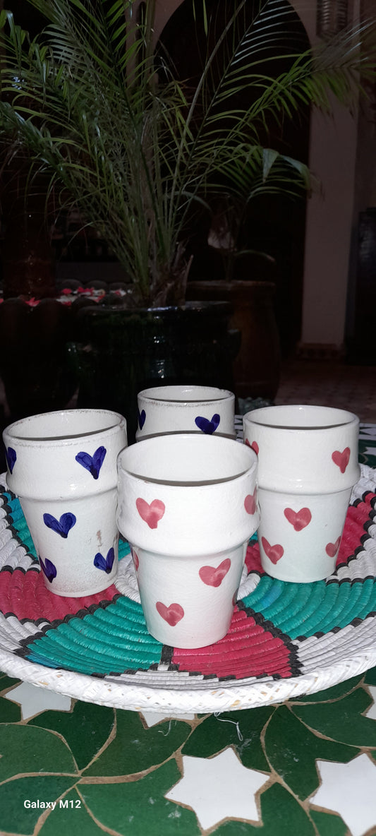 Handmade coffee cups with red and blue hearts