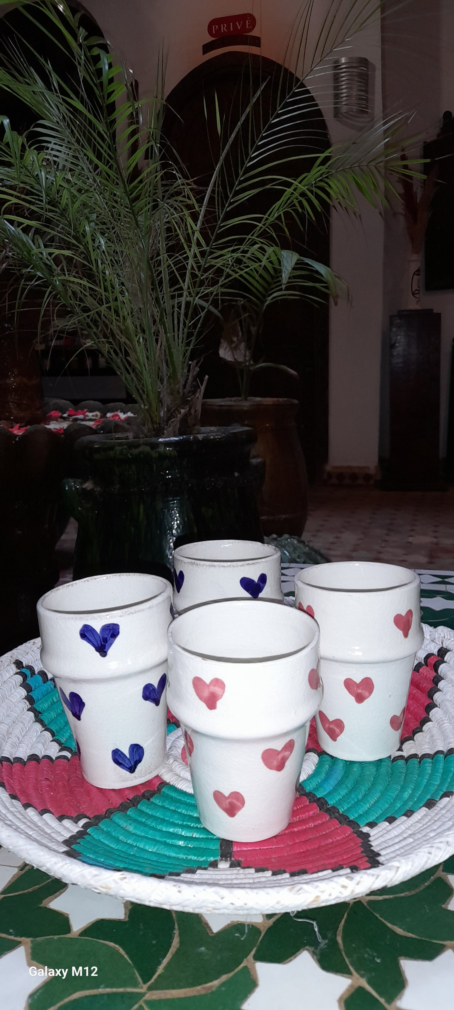 Handmade coffee cups with red and blue hearts
